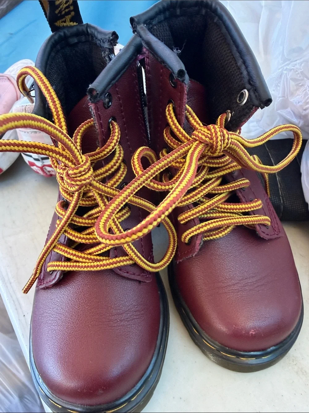 Dr. Martens Kids Burgundy Leather Ankle Boots with Yellow Laces